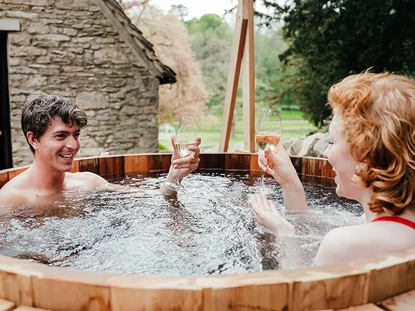 South Lodge couple in cedar wood hot tub